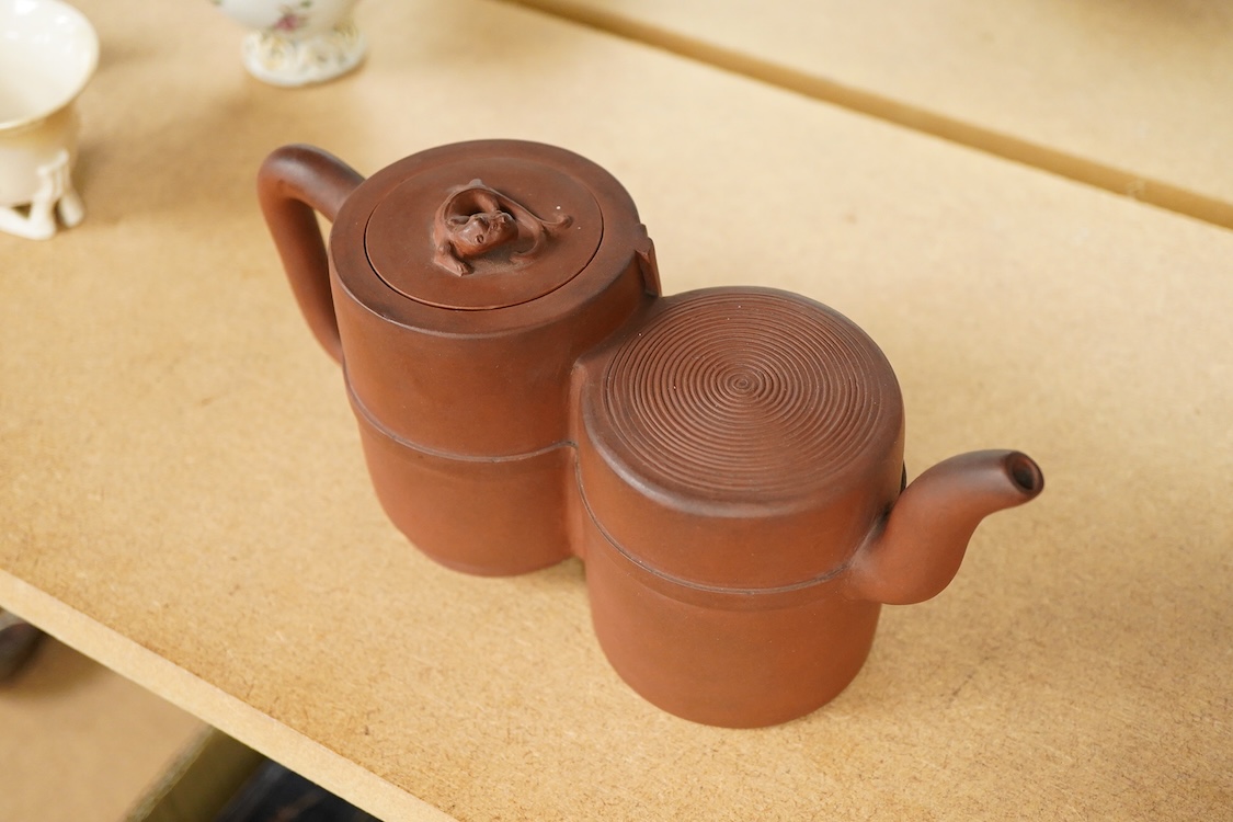 A Chinese Yixing conjoined teapot and cover, 21cm wide